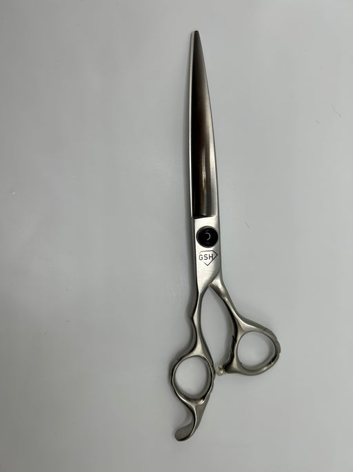 Left-handed 7-inch Curve Groomer Supply House shears with ergonomic handle and sharp blades for precise grooming tasks.